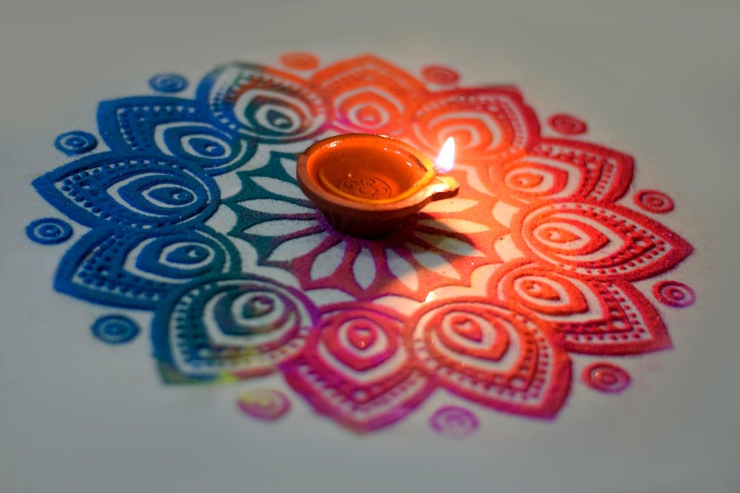 Diwali Wishes 2026 image with rangoli and glowing diyas