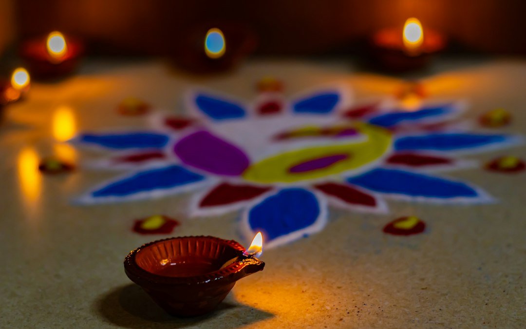 Rangoli and diya festive image for Diwali wishes